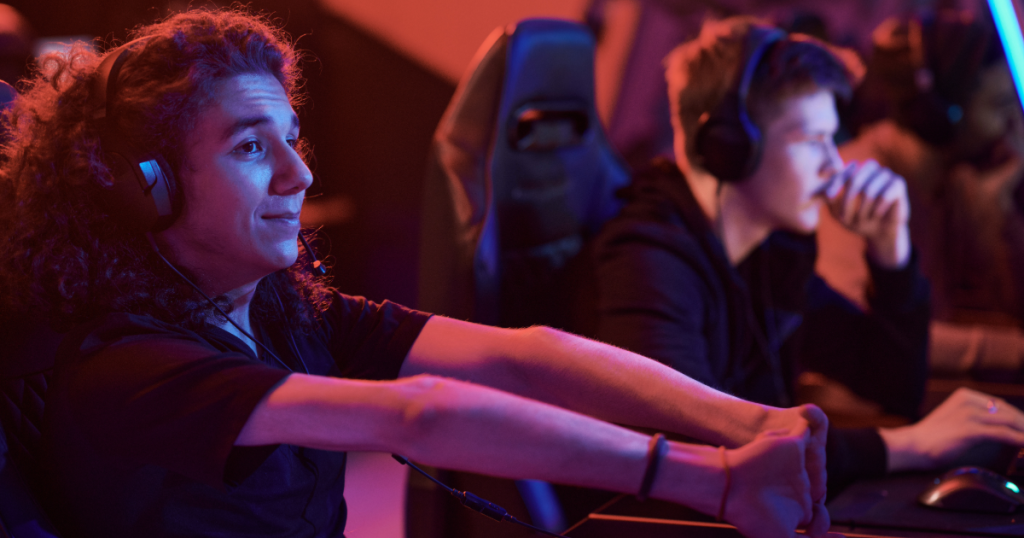 A gamer calmly prepping for a session by stretching fingers. Recovery after gaming and mid-game are vital.