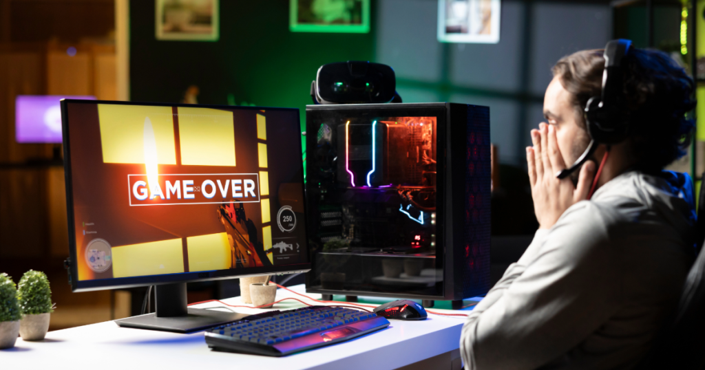 A gamer leaning back from their setup with a slight frown, showing signs of frustration or fatigue