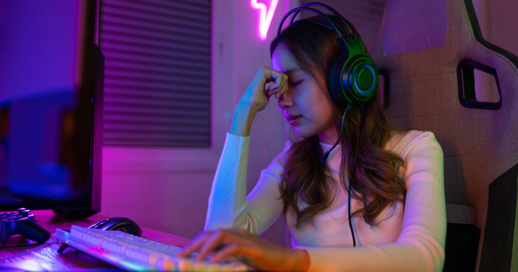 A player looking at the screen with a tired expression